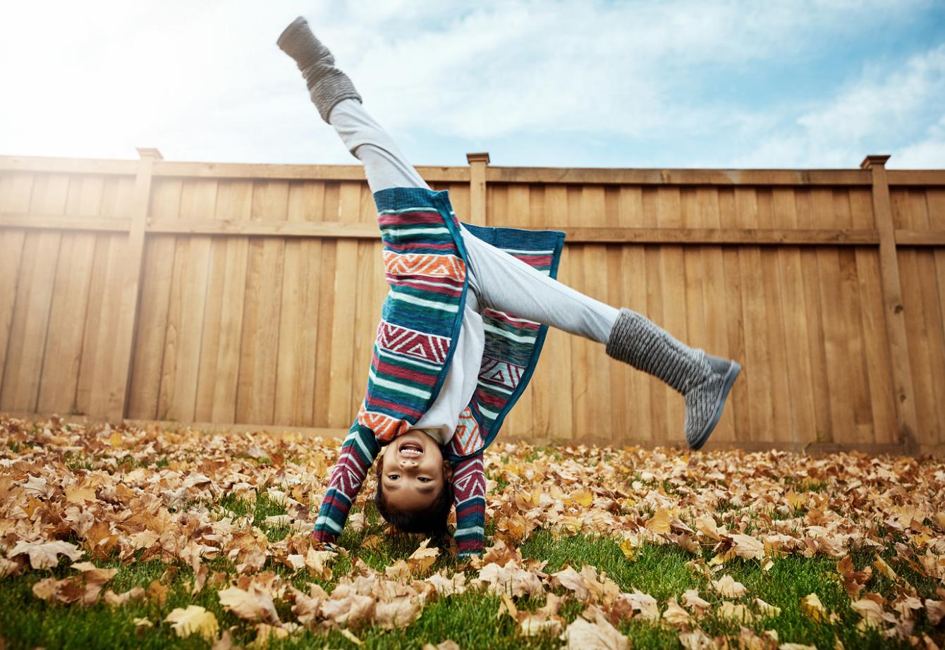 A young child doing a cartwheel