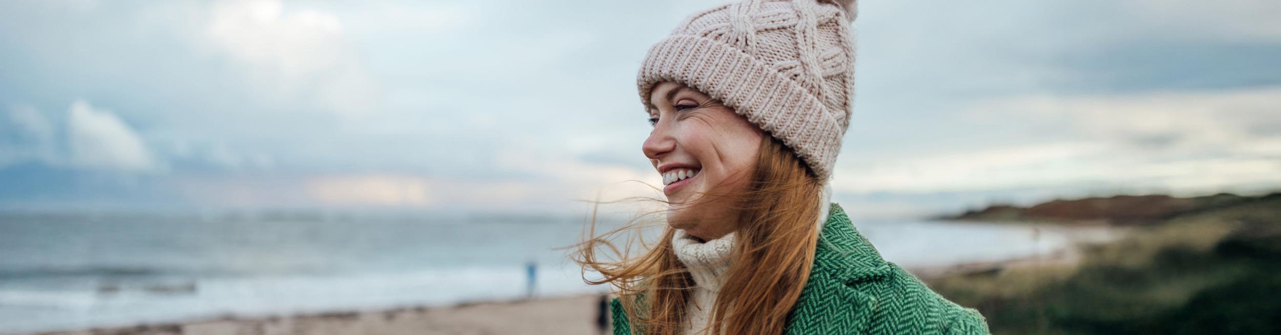 A smiling woman on the beach