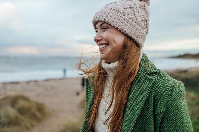 A smiling woman on the beach